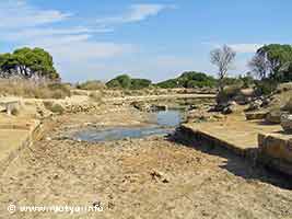 The entrance of the Cothon of Motya. Similar to the harbours of Carthage it was considered by archaeologists an inner harbour for ships. In later medieval times it would have also been used to produce salt. Nowadays the waters are very shallow and the sea does not enter it anymore in the summer. The entrance of the Cothon of Motya. Similar to the harbours of Carthage it was considered by archaeologists an inner harbour for ships. In later medieval times it would have also been used to produce salt. Nowadays the waters are very shallow and the sea does not enter it anymore in the summer.