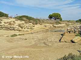 Another view of the entrance of the Cothon and the canal connecting it to the sea. During the summer the entrance lies completely dry. Another view of the entrance of the Cothon and the canal connecting it to the sea. During the summer the entrance lies completely dry.