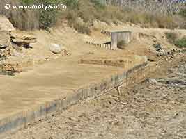 Detail of the entrance of the Cothon. Probably the basin could be closed with a wooden structure at some time in it's history Detail of the entrance of the Cothon. Probably the basin could be closed with a wooden structure at some time in it's history