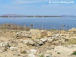 The north side of Motya. To the left the path lead to the tophet where in 2006 excavations were going on. The stagnone of Marsala with the long island and in the background the Egadian islands Favignana (left) and Levanzo (right) The north side of Motya. To the left the path lead to the tophet where in 2006 excavations were going on. The stagnone of Marsala with the long island and in the background the Egadian islands Favignana (left) and Levanzo (right)