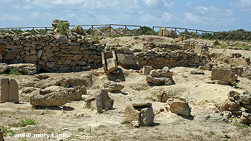 Part of a sarcophage in the necropolis of Motya. In the foreground cist graves, made of slabs of stone containing an urn with cremated remains. Part of a sarcophage in the necropolis of Motya. In the foreground cist graves, made of slabs of stone containing an urn with cremated remains.