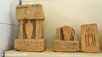 Another inscription in phoenician on this stele with a relief of a stylistic form between two pillars. Another inscription in phoenician on this stele with a relief of a stylistic form between two pillars.