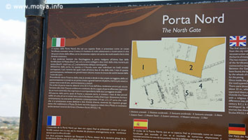 A sign explains that in front of the northern gate the remains of two small sanctuaries have been found. Near the gate was the port where merchants loaded and unloaded their ships. A sign explains that in front of the northern gate the remains of two small sanctuaries have been found. Near the gate was the port where merchants loaded and unloaded their ships.