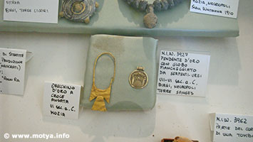 Golden earring cross shaped and hanger with globe and snakes Golden earring cross shaped and hanger with globe and snakes